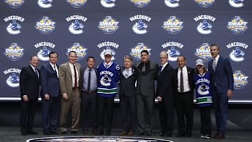 Jun 24, 2016; Buffalo, NY, USA; Olli Juolevi poses for a photo after being selected as the number five overall draft pick by the Vancouver Canucks in the first round of the 2016 NHL Draft at the First Niagra Center. Mandatory Credit: Timothy T. Ludwig-USA TODAY Sports