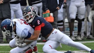 Denton Ryan's Billy Bowman Jr. tackles Cooper's Brady Miller after Miller picked off a pass on the game's opening drive. Cooper cashed the pick in for a TD, but Ryan won the Region I-5A Division I semifinal game 58-20 on Friday, Nov. 29, 2019, at the C.H. Collins Athletic Complex in Denton.Cooper Ryan Fb 00