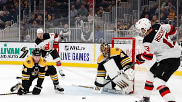 BOSTON, MA - SEPTEMBER 25: New Jersey Devils center Nico Hischier (13) tries to slide a pass by Boston Bruins defenseman Steven Kampfer (44) and Boston Bruins goalie Jaroslav Halak (41) for New Jersey Devils defenseman Matt Tennyson (7) during a preseason game between the Boston Bruins and the New Jersey Devils on September 25, 2019, at TD Garden in Boston, Massachusetts. (Photo by Fred Kfoury III/Icon Sportswire via Getty Images)