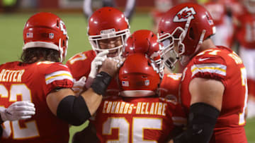 KANSAS CITY, MISSOURI - SEPTEMBER 10: Clyde Edwards-Helaire #25 of the Kansas City Chiefs is congratulated by teammates after scoring a touchdown against the Houston Texans during the third quarter at Arrowhead Stadium on September 10, 2020 in Kansas City, Missouri. (Photo by Jamie Squire/Getty Images)