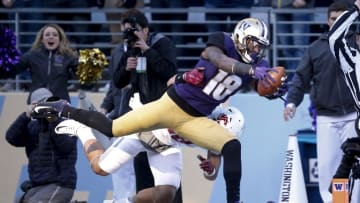 Nov 27, 2015; Seattle, WA, USA; Washington Huskies wide receiver Isaiah Renfro (18) lunges for the end zone while Washington State Cougars safety Shalom Luani (18) pulls him out of bounds during the second quarter at Husky Stadium. Mandatory Credit: Jennifer Buchanan-USA TODAY Sports