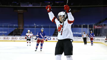 Mikhail Maltsev #23 of the New Jersey Devils celebrates his empty net and first NHL goal in the third period against the New York Rangers (Photo by Elsa/Getty Images)