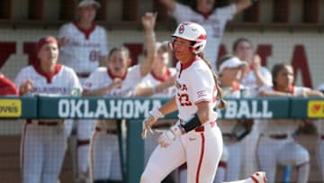 Oklahoma's Tiare Jennings (23) runs home to score a run in the fourth inning of a Bedlam softball game between the University of Oklahoma Sooners (OU) and the Oklahoma State University Cowgirls (OSU) at Marita Hynes Field in Norman, Okla., Saturday, May 7, 2022. Oklahoma won 5-3.Bedlam Softball