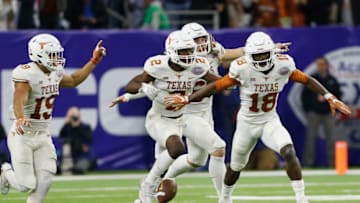 HOUSTON, TX - DECEMBER 27: Davante Davis #18 of the Texas Longhorns celebrates with this teammates after an interception late in the fourth quarter against the Missouri Tigers at NRG Stadium on December 27, 2017 in Houston, Texas. (Photo by Bob Levey/Getty Images)