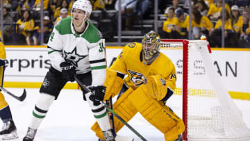 Juuse Saros #74 of the Nashville Predators leans to see around Denis Gurianov #34 of the Dallas Stars during the second period at Bridgestone Arena on October 13, 2022 in Nashville, Tennessee. (Photo by Brett Carlsen/Getty Images)