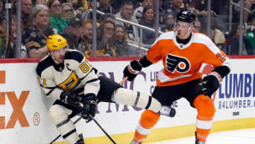 Mar 11, 2023; Pittsburgh, Pennsylvania, USA; Pittsburgh Penguins center Sidney Crosby (87) moves the puck against Philadelphia Flyers defenseman Nick Seeler (24) during the second period at PPG Paints Arena. Mandatory Credit: Charles LeClaire-USA TODAY Sports
