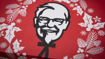 TOKYO, JAPAN - DECEMBER 23: Picture of Colonel Sanders on KFC Christmas meal box is seen on December 23, 2020 in Tokyo, Japan. KFC at Christmas has become something of a tradition in Japan with some attributing its yuletide popularity to a kindergarten delivery being made in a Santa Claus outfit which was such a success it was requested by a number of other schools and subsequently gave the company the idea of associating its product to Christmas. The chain launched its first Christmas campaign in December 1974, and has continued to do so every year at all its outlets nationwide. In 2018, KFC Japan posted all-time high sales of roughly 68 million USD for the five days from December 21 to 25. Roughly 10 percent of its annual turnover for the entire year. (Photo by Yuichi Yamazaki/Getty Images)