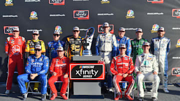 LAS VEGAS, NV - SEPTEMBER 15: Elliott Sadler, driver of the #1 OneMain Financial Chevrolet, Justin Allgaier, driver of the #7 BRANDT Professional Agriculture Chevrolet, Ryan Reed, driver of the #16 Drive Down A1C Lilly Diabetes Ford, Austin Cindric, driver of the #22 MoneyLion Ford, Ross Chastain, driver of the #42 DC Solar Chevrolet, x11 Cole Custer, driver of the #00 Code 3 Associates Ford, Matt Tifft, driver of the #2 KCMG Chevrolet, Daniel Hemric, driver of the #21 South Point Hotel & Casino Chevrolet, Tyler Reddick, driver of the #9 Nationwide Children's Chevrolet, Brandon Jones, driver of the #19 Menards Mastercraft Doors Toyota, and Christopher Bell, driver of the #20 GameStop Tomb Raider Toyota pose for a photo after making the the NASCAR Xfinity Series Playoffs following the NASCAR Xfinity Series DC Solar 300 at Las Vegas Motor Speedway on September 15, 2018 in Las Vegas, Nevada. (Photo by Sam Wasson/Getty Images)