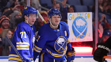 Apr 16, 2022; Buffalo, New York, USA; Buffalo Sabres right wing Kyle Okposo (21) celebrates his goal with left wing Victor Olofsson (71) during the second period against the Philadelphia Flyers at KeyBank Center. Mandatory Credit: Timothy T. Ludwig-USA TODAY Sports