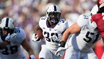 FAYETTEVILLE, AR - SEPTEMBER 9: Sewo Olonilua #33 of the TCU Horned Frogs runs the ball for a touchdown against the Arkansas Razorbacks at Donald W. Reynolds Razorback Stadium on September 9, 2017 in Fayetteville, Arkansas. The Horn Frogs defeated the Razorbacks 28-7. (Photo by Wesley Hitt/Getty Images)
