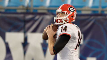 CHARLOTTE, NC - DECEMBER 30: Hutson Mason #14 of the Georgia Bulldogs warms up before the Belk Bowl against the Louisville Cardinals at Bank of America Stadium on December 30, 2014 in Charlotte, North Carolina. (Photo by Grant Halverson/Getty Images)