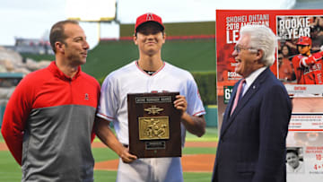 ANAHEIM, CA - APRIL 30: Shohei Ohtani #17 stands next to general manager Billy Eppler and team president Dennis Kuhl as he receives his America League Rookie of the Year award before the game against the Toronto Blue Jays at Angel Stadium of Anaheim on April 30, 2019 in Anaheim, California. (Photo by Jayne Kamin-Oncea/Getty Images)