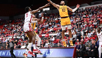 Jan 28, 2023; Pullman, Washington, USA; Arizona State Sun Devils guard Frankie Collins (10) rebounds the ball against Washington State Cougars guard Kymany Houinsou (31) in the second half at Friel Court at Beasley Coliseum. Washington State won 75-58. Mandatory Credit: James Snook-USA TODAY Sports