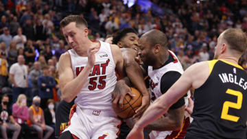 Utah Jazz guard Donovan Mitchell (45) tries to grab the ball away from Miami Heat guard Duncan Robinson (55) and forward P.J. Tucker (17)(Chris Nicoll-USA TODAY Sports)
