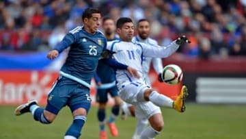 Mar 28, 2015; Landover, MD, USA; El Salvador forward Nelson Bonilla (11) plays the ball in front of Argentina defender Ramiro Funes-Mori (25) during the first half at FedEx Field. Mandatory Credit: Tommy Gilligan-USA TODAY Sports