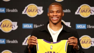 LOS ANGELES, CALIFORNIA - AUGUST 10: Russell Westbrook #0 of the Los Angeles Lakers poses for a picture with his jersey during a press conference at Staples Center on August 10, 2021 in Los Angeles, California. (Photo by Katelyn Mulcahy/Getty Images)