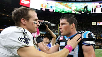 Oct 16, 2016; New Orleans, LA, USA; New Orleans Saints quarterback Drew Brees (9) and Carolina Panthers middle linebacker Luke Kuechly (59) talk after their game at the Mercedes-Benz Superdome. The Saints won 41-38. Mandatory Credit: Chuck Cook-USA TODAY Sports