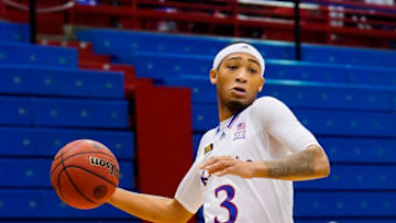 Jan 2, 2021; Lawrence, Kansas, USA; Kansas Jayhawks guard Dajuan Harris (3) dribbles the ball against the Texas Longhorns during the first half at Allen Fieldhouse. Mandatory Credit: Jay Biggerstaff-USA TODAY Sports