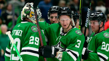 Mar 2, 2022; Dallas, Texas, USA; Dallas Stars goaltender Jake Oettinger (29) and defenseman John Klingberg (3) and center Radek Faksa (12) and defenseman Ryan Suter (20) celebrate the win over the Los Angeles Kings at the American Airlines Center. Mandatory Credit: Jerome Miron-USA TODAY Sports
