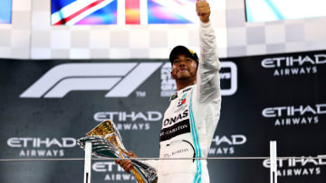 ABU DHABI, UNITED ARAB EMIRATES - DECEMBER 01: Race winner Lewis Hamilton of Great Britain and Mercedes GP celebrates on the podium during the F1 Grand Prix of Abu Dhabi at Yas Marina Circuit on December 01, 2019 in Abu Dhabi, United Arab Emirates. (Photo by Dan Istitene/Getty Images)