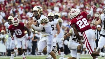 Sep 24, 2016; Bloomington, IN, USA; Wake Forest Demon Deacons quarterback John Wolford (10) runs the ball in for a touchdown against the Indiana Hoosiers during the second half of the game at Memorial Stadium. Wake Forest defeated Indiana 33-28. Mandatory Credit: Marc Lebryk-USA TODAY Sports