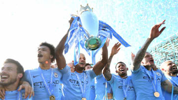 BRIGHTON, ENGLAND - MAY 12: Vincent Kompany of Manchester City lifts the Premier League Trophy after winning the title during the Premier League match between Brighton & Hove Albion and Manchester City at American Express Community Stadium on May 12, 2019 in Brighton, United Kingdom. (Photo by Michael Regan/Getty Images)