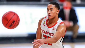 LUBBOCK, TEXAS - DECEMBER 29: Guard Nimari Burnett #25 of the Texas Tech Red Raiders passes the ball during the second half of the college basketball game against the Incarnate Word Cardinals at United Supermarkets Arena on December 29, 2020 in Lubbock, Texas. (Photo by John E. Moore III/Getty Images)
