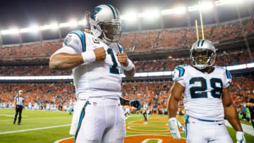 Sep 8, 2016; Denver, CO, USA; Carolina Panthers quarterback Cam Newton (1) does his Superman pose as he celebrates his second quarter touchdown with running back Jonathan Stewart (28) against the Denver Broncos at Sports Authority Field at Mile High. Mandatory Credit: Mark J. Rebilas-USA TODAY Sports