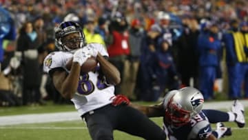 Jan 10, 2015; Foxborough, MA, USA; Baltimore Ravens wide receiver Torrey Smith (82) catches the ball in front of New England Patriots cornerback Brandon Browner (39) during the third quarter in the 2014 AFC Divisional playoff football game at Gillette Stadium. Mandatory Credit: Winslow Townson-USA TODAY Sports