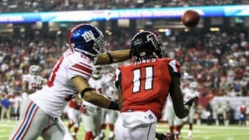 Dec 16, 2012; Atlanta, GA, USA; Atlanta Falcons wide receiver Julio Jones (11) catches a touchdown pass in front of New York Giants cornerback Corey Webster (23) in the second half at the Georgia Dome. The Falcons won 34-0. Mandatory Credit: Daniel Shirey-USA TODAY Sports