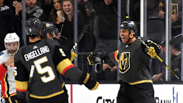 Ryan Reaves #75 of the Vegas Golden Knights celebrates with teammates after scoring a third-period goal against the Calgary Flames. (Photo by Ethan Miller/Getty Images)