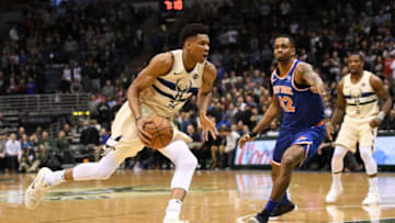 MILWAUKEE, WI - MARCH 09: Giannis Antetokounmpo #34 of the Milwaukee Bucks drives around Lance Thomas #42 of the New York Knicks during a game at the Bradley Center on March 9, 2018 in Milwaukee, Wisconsin. NOTE TO USER: User expressly acknowledges and agrees that, by downloading and or using this photograph, User is consenting to the terms and conditions of the Getty Images License Agreement. (Photo by Stacy Revere/Getty Images)