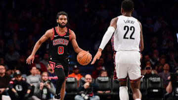 NEW YORK, NEW YORK - MARCH 08: Coby White #0 of the Chicago Bulls is defended by Caris LeVert #22 of the Brooklyn Nets in the second half at Barclays Center on March 08, 2020 in New York City. NOTE TO USER: User expressly acknowledges and agrees that, by downloading and or using this photograph, User is consenting to the terms and conditions of the Getty Images License Agreement. (Photo by Steven Ryan/Getty Images)