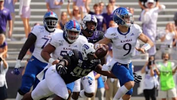 FORT WORTH, TEXAS - SEPTEMBER 28: Defensive tackle Terrell Cooper #95 of the TCU Horned Frogs pressures quarterback Carter Stanley #9 of the Kansas Jayhawks in the first quarter at Amon G. Carter Stadium on September 28, 2019 in Fort Worth, Texas. (Photo by Richard Rodriguez/Getty Images)