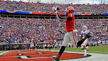 JACKSONVILLE, FL - OCTOBER 27: Jeremiah Holloman #9 of the Georgia football Bulldogs catches a touchdown during a game against the Florida Gators at TIAA Bank Field on October 27, 2018 in Jacksonville, Florida. (Photo by Mike Ehrmann/Getty Images)