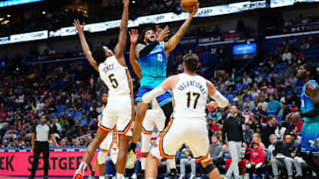 Mar 11, 2022; New Orleans, Louisiana, USA; Charlotte Hornets forward Miles Bridges (0) shoots the ball against New Orleans Pelicans forward Herbert Jones (5) during the second quarter at Smoothie King Center. Mandatory Credit: Andrew Wevers-USA TODAY Sports