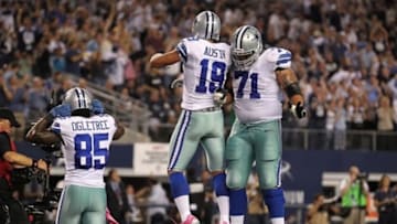 Oct 1, 2012; Arlington, TX, USA; Dallas Cowboys receiver Miles Austin (19) celebrates a touchdown with guard Nate Livings (71) in the second quarter against the Chicago Bears at Dallas Cowboys Stadium. Mandatory Credit: Matthew Emmons-USA TODAY Sports