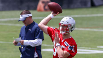 Auburn footballJun 10, 2021; Foxborough, MA, USA; New England Patriots quarterback Mac Jones (50) participates in drills during OTAs at the New England Patriots practice complex. Mandatory Credit: Paul Rutherford-USA TODAY Sports