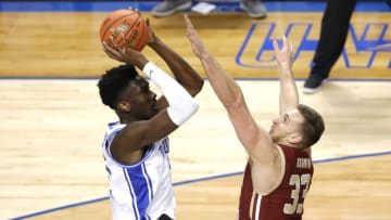 GREENSBORO, NORTH CAROLINA - MARCH 09: Mark Williams #15 of the Duke Blue Devils attempts a jump shot against James Karnik #33 of the Boston College Eagles during the first half of their first round game in the ACC Men's Basketball Tournament at Greensboro Coliseum on March 09, 2021 in Greensboro, North Carolina. (Photo by Jared C. Tilton/Getty Images)