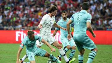 SINGAPORE - JULY 28: Aaron Ramsey of Arsenal challenges Adrien Rabiot of Paris Saint Germain for the ball during the International Champions Cup match between Arsenal and Paris Saint Germain at the National Stadium on July 28, 2018 in Singapore. (Photo by Suhaimi Abdullah/Getty Images for ICC)