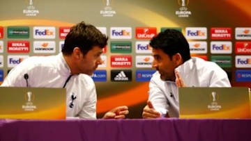 FLORENCE, ITALY - FEBRUARY 17: Mauricio Pochettino, Manager of Tottenham Hotspur (L) talks with Jesus Perez, Assistant Head Coach of Tottenham Hotspur during a press conference ahead of the UEFA Europa League Round of 32 match between ACF Fiorentina and Tottenham Hotspur at Stadio Artemio Franchi on February 17, 2016 in Florence, Italy. (Photo by Clive Rose/Getty Images)