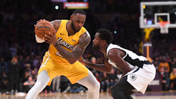 LOS ANGELES, CA - DECEMBER 25: Patrick Beverley #21 of the Los Angeles Clippers guards LeBron James #23 of the Los Angeles Lakers in the second half of the game at Staples Center on December 25, 2019 in Los Angeles, California. NOTE TO USER: User expressly acknowledges and agrees that, by downloading and/or using this Photograph, user is consenting to the terms and conditions of the Getty Images License Agreement. (Photo by Jayne Kamin-Oncea/Getty Images)