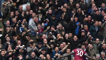 West Ham United's Michail Antonio celebrates in front of the West Ham fans. (Photo by Ben STANSALL / AFP) / RESTRICTED TO EDITORIAL USE. No use with unauthorized audio, video, data, fixture lists, club/league logos or 'live' services. Online in-match use limited to 120 images. An additional 40 images may be used in extra time. No video emulation. Social media in-match use limited to 120 images. An additional 40 images may be used in extra time. No use in betting publications, games or single club/league/player publications. / (Photo credit should read BEN STANSALL/AFP via Getty Images)