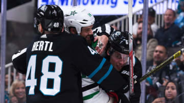 SAN JOSE, CA - DECEMBER 13: Dallas Stars Left Wing Jamie Benn (14) grapples with San Jose Sharks Defenceman Justin Braun (61) and San Jose Sharks Left Wing Tomas Hertl (48) during the National Hockey League game between the Dallas Stars and the San Jose Sharks on December 13, 2018 at SAP Center in San Jose, CA. (Photo by Cody Glenn/Icon Sportswire via Getty Images)