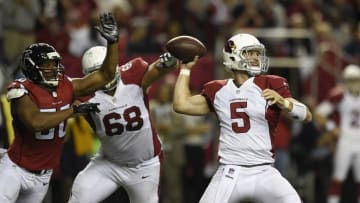 Nov 30, 2014; Atlanta, GA, USA; Arizona Cardinals quarterback Drew Stanton (5) passes in front of Atlanta Falcons defensive end Osi Umenyiora (50) during the second half at the Georgia Dome. The Falcons defeated the Cardinals 29-18. Mandatory Credit: Dale Zanine-USA TODAY Sports