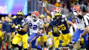 ATLANTA, GEORGIA - DECEMBER 29: Lamical Perine #22 of the Florida Gators runs for a fourth quarter touchdown against the Michigan Wolverines during the Chick-fil-A Peach Bowl at Mercedes-Benz Stadium on December 29, 2018 in Atlanta, Georgia. (Photo by Mike Zarrilli/Getty Images)