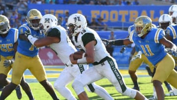 PASADENA, CA - SEPTEMBER 09: Cole Brownholtz #17 of the Hawaii Warriors gets pas Keisean Lucier-South #11 of the UCLA Bruins as he runs for a touch down in the fourth quarter of the game at the Rose Bowl on September 9, 2017 in Pasadena, California. (Photo by Jayne Kamin-Oncea/Getty Images)