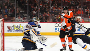 PHILADELPHIA, PENNSYLVANIA - JANUARY 07: Jordan Binnington #50 of the St. Louis Blues makes the second period save as Travis Konecny #11 of the Philadelphia Flyers looks for a rebound during the second period at the Wells Fargo Center on January 07, 2019 in Philadelphia, Pennsylvania. (Photo by Bruce Bennett/Getty Images)
