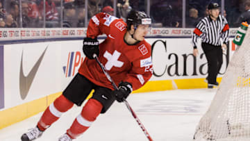 TORONTO, ON - JANUARY 02: Forward Pius Suter #24 of Switzerland moves the puck against Germany during the 2015 IIHF World Junior Championship on January 02, 2015 at the Air Canada Centre in Toronto, Ontario, Canada. (Photo by Dennis Pajot/Getty Images)