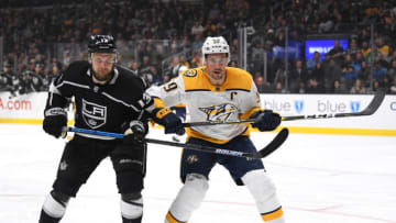 LOS ANGELES, CALIFORNIA - MARCH 14: Roman Josi #59 of the Nashville Predators and Kyle Clifford #13 of the Los Angeles Kings skate to the puck during a 3-1 Predators win at Staples Center on March 14, 2019 in Los Angeles, California. (Photo by Harry How/Getty Images)